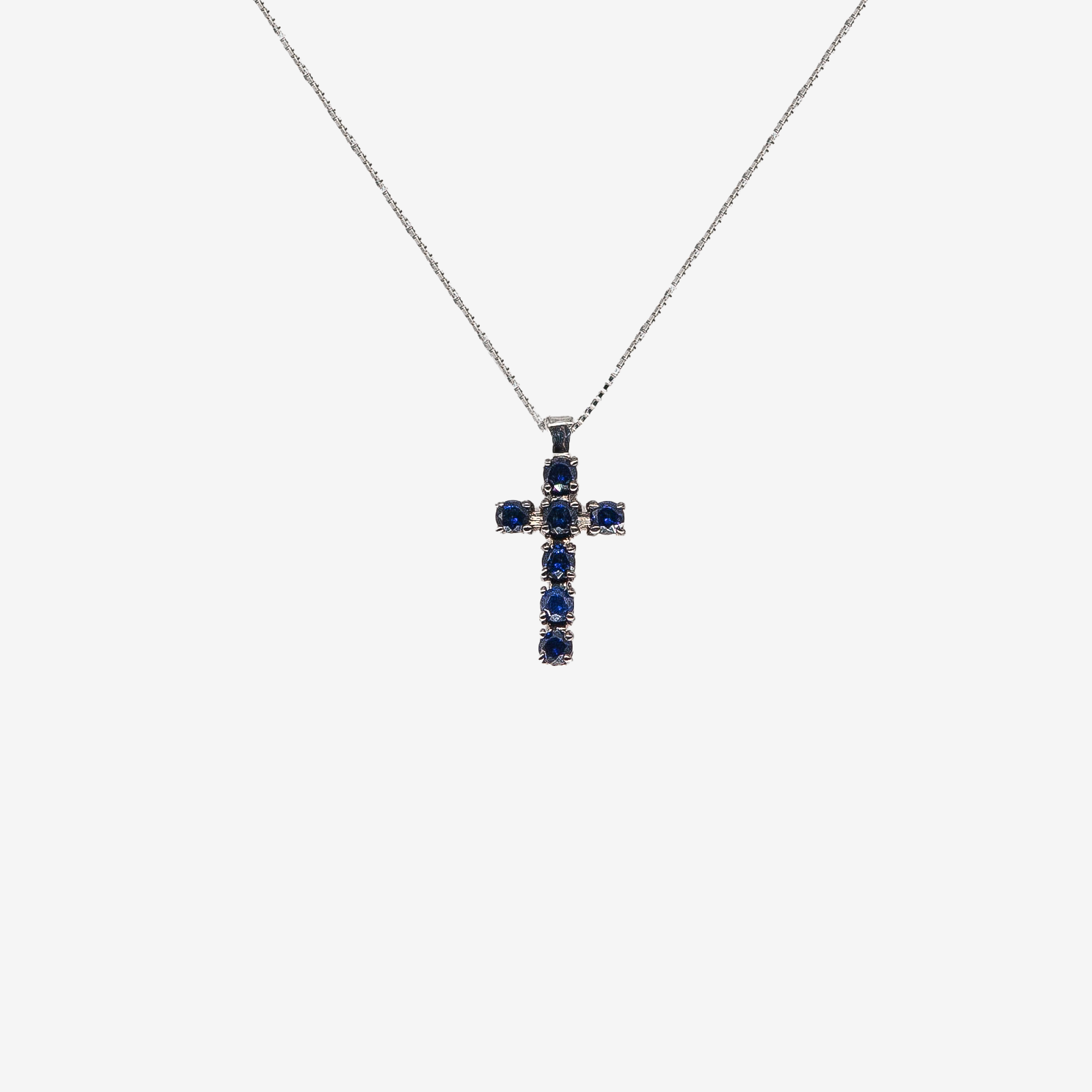 Cross necklace with sapphires